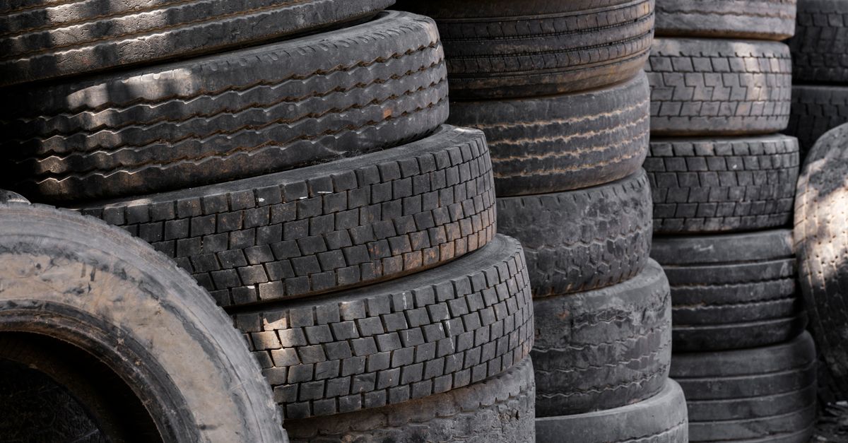Stacked end-of-life tyres awaiting processing